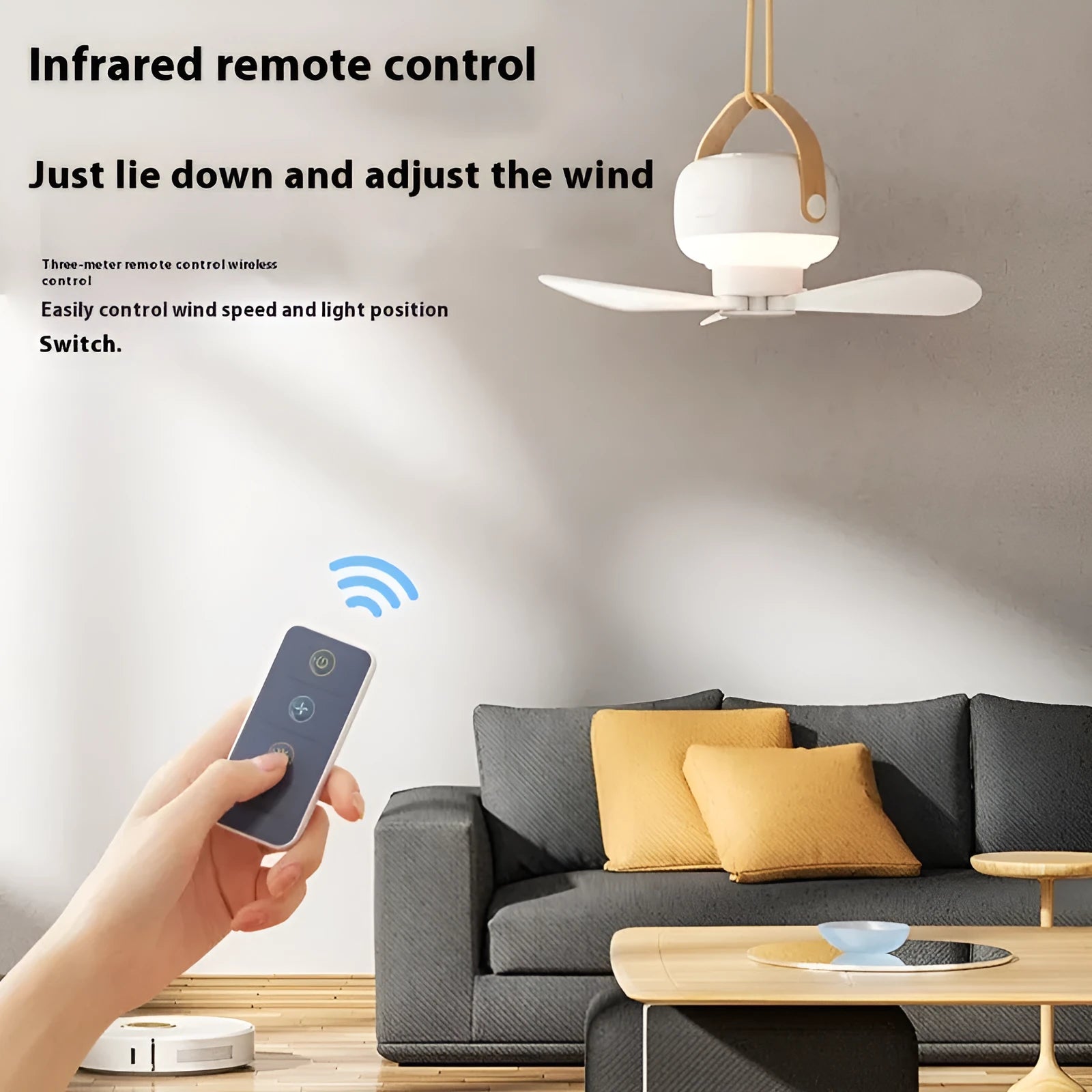 Small white rechargeable ceiling fan with fan blades and night light, hanging from a metal wire bracket for camping