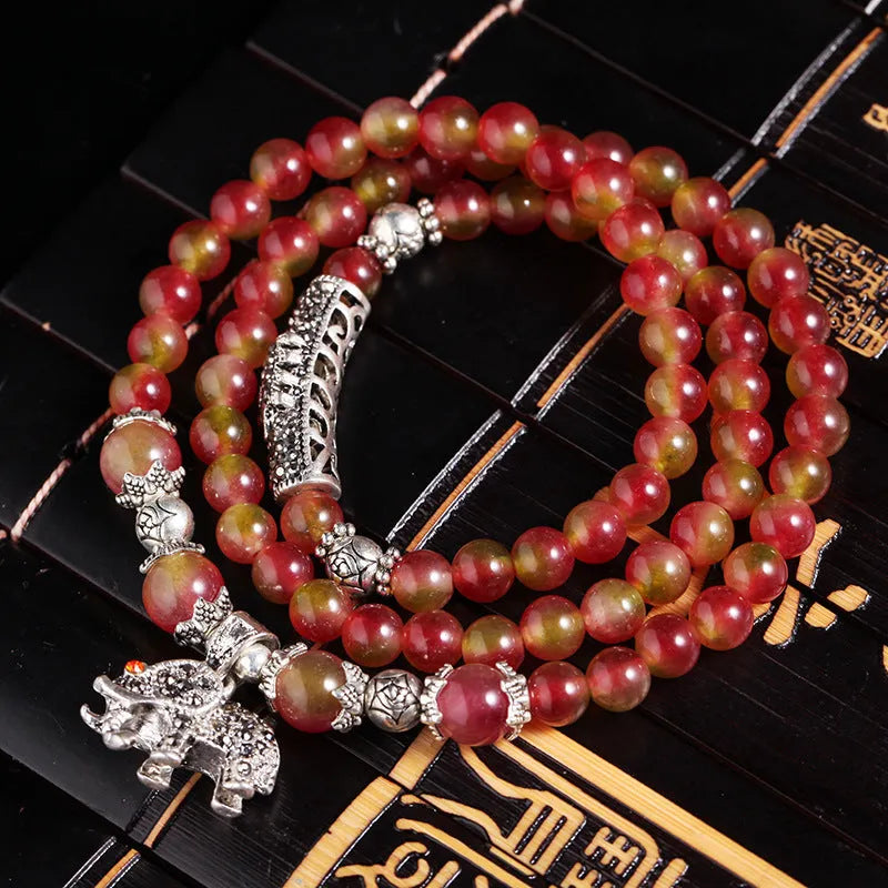 Handmade watermelon crystal Chinese knot bracelet with traditional geometric designs in 8mm and 6mm elephant style sizes