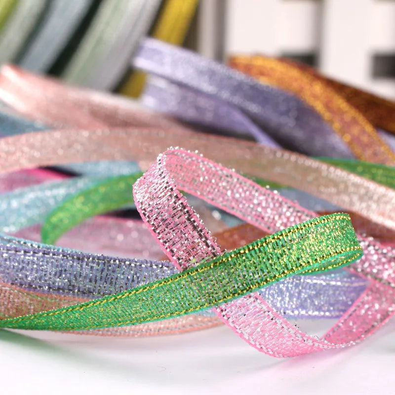 Roll of narrow 0.6cm wide polyester gift wrapping ribbon in an assorted colour, showing 22 metre length.