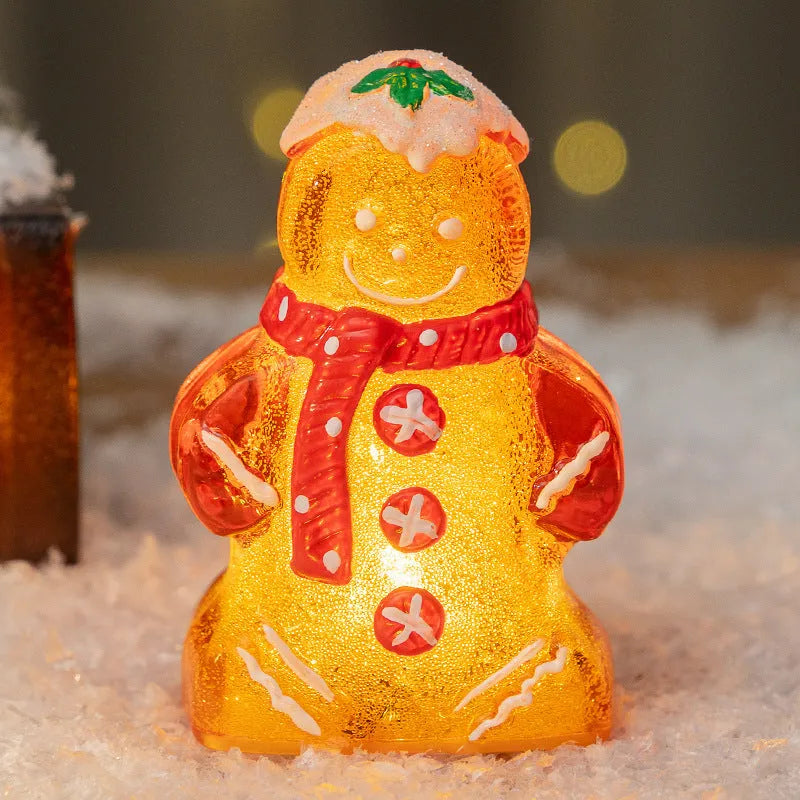 Glowing Christmas gingerbread man snowman ornament in plastic with four colour variations including clear, white and red scarf options