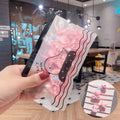 Children's elastic hair loops in pink with flower pattern on white background