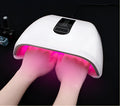 White 96W LED nail dryer with red light, 48 lamp beads, and removal base tray on a desk