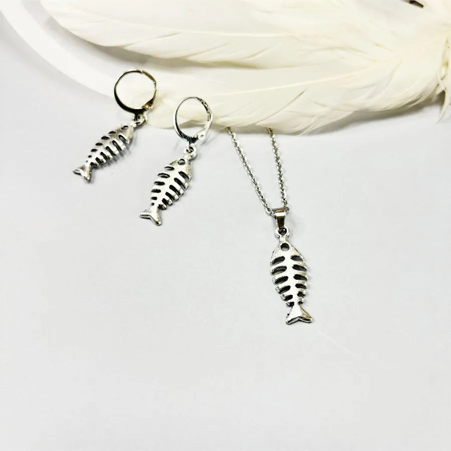 Fishbone motif pendant necklace and matching earrings set in retro-style alloy jewellery with adjustable chain.