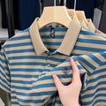 Men's red striped casual short sleeve shirt with a mosaic pattern on a mannequin.