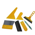 Seven-piece automotive and architectural film tool set with scrapers, knives, and a pressing block.