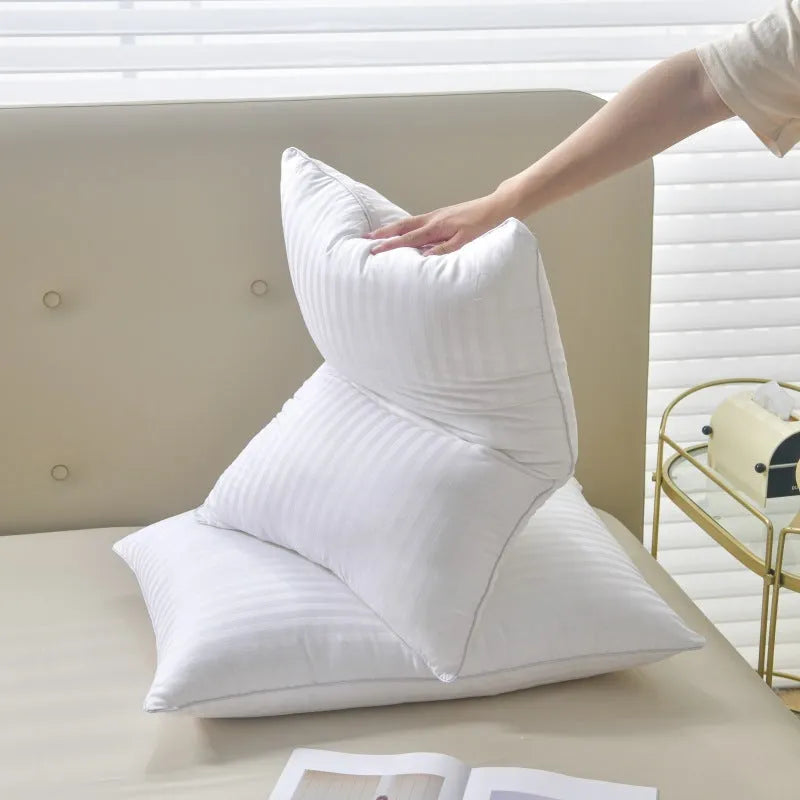 White cotton satin stripe feather pillow with duck down filling showing striped fabric detail