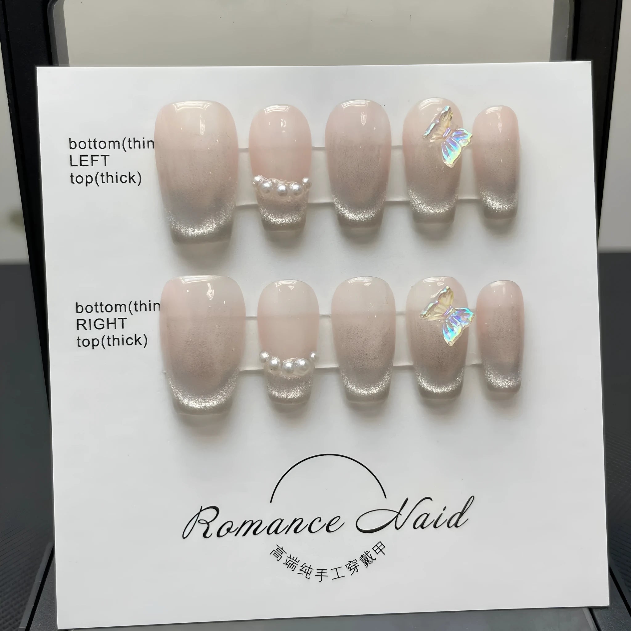 Women's handmade blush colour short artificial nail manicure set showing sizes XS, S, M, L.