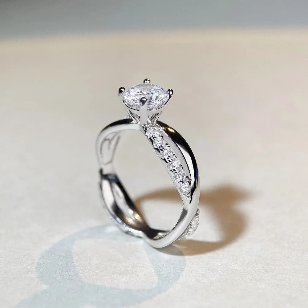 Silver moissanite ring with twisted arm geometric design and 1 carat centre stone