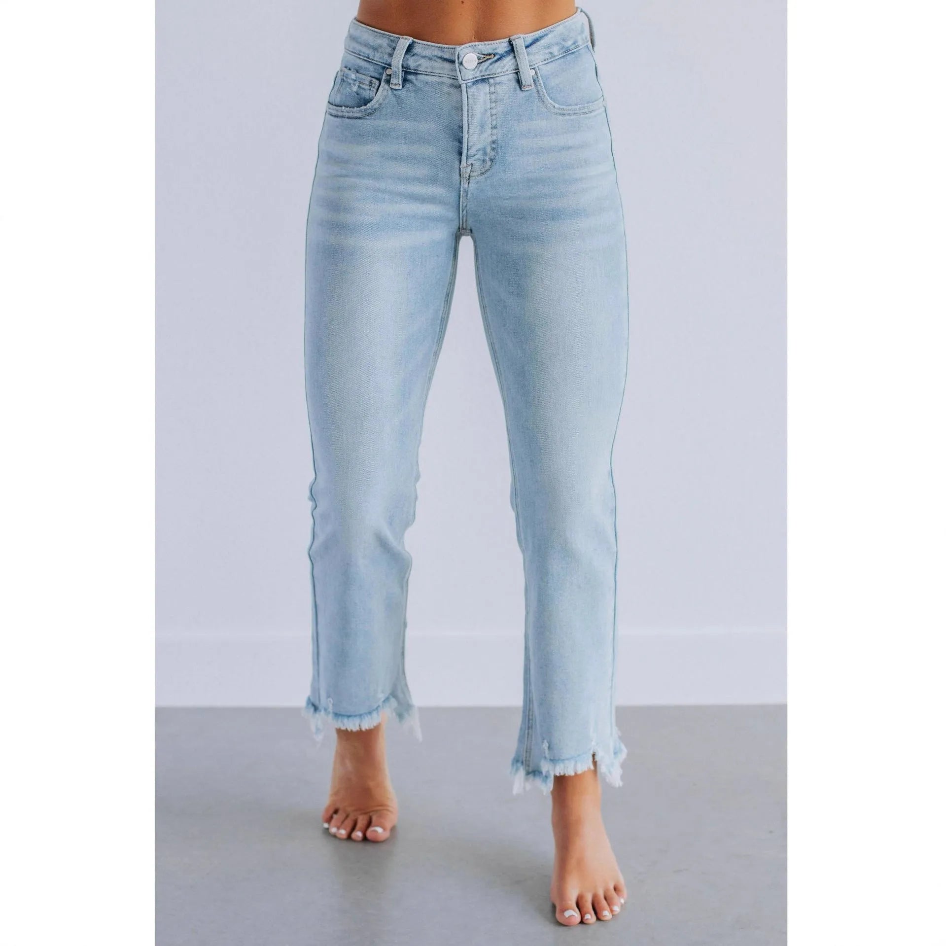 Women's solid colour cotton denim jeans with a hand-worn finish in dark blue.