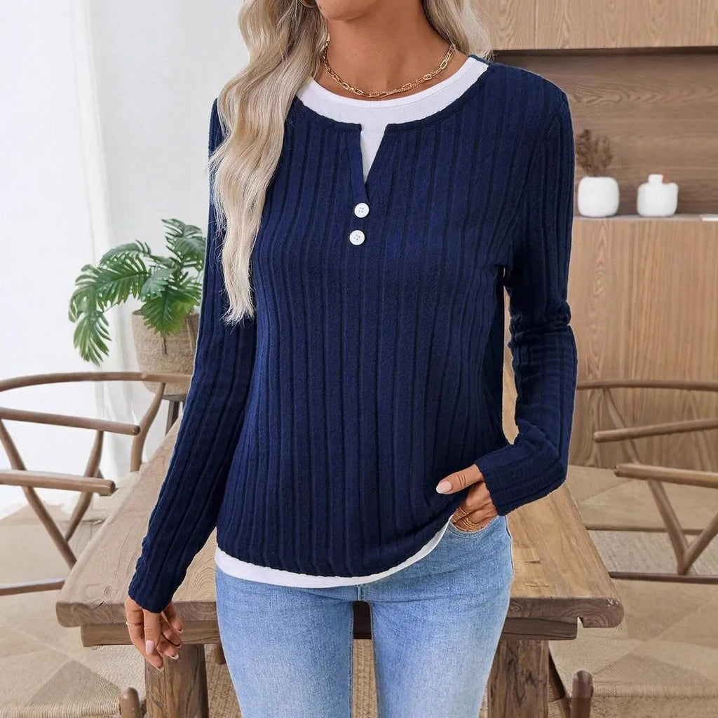 Women's black fake two-piece pullover sweater with a round neck and button front, showing concave stripe texture.