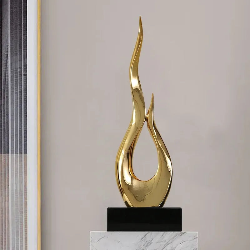 Resin decorative ornament in gold colour with modern minimalist design for festival decoration