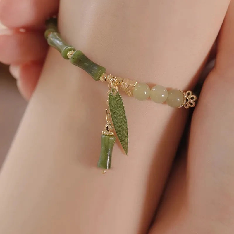 Chinese style glass bamboo leaf bracelet for women with manual craft details.