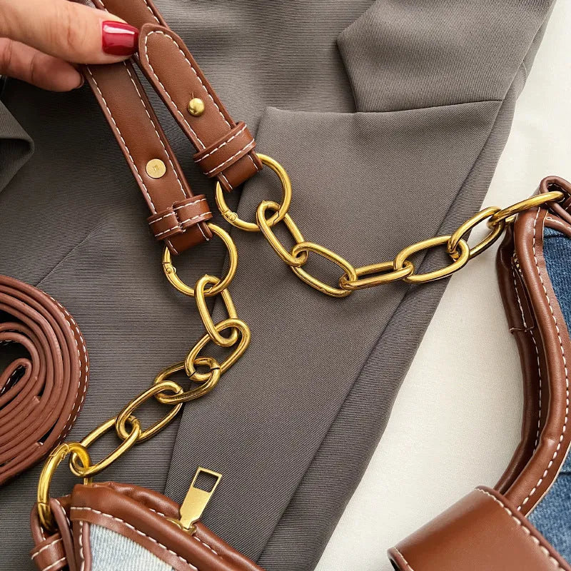 Brown denim bucket shoulder bag with diamond mesh panels and metallic chain strap