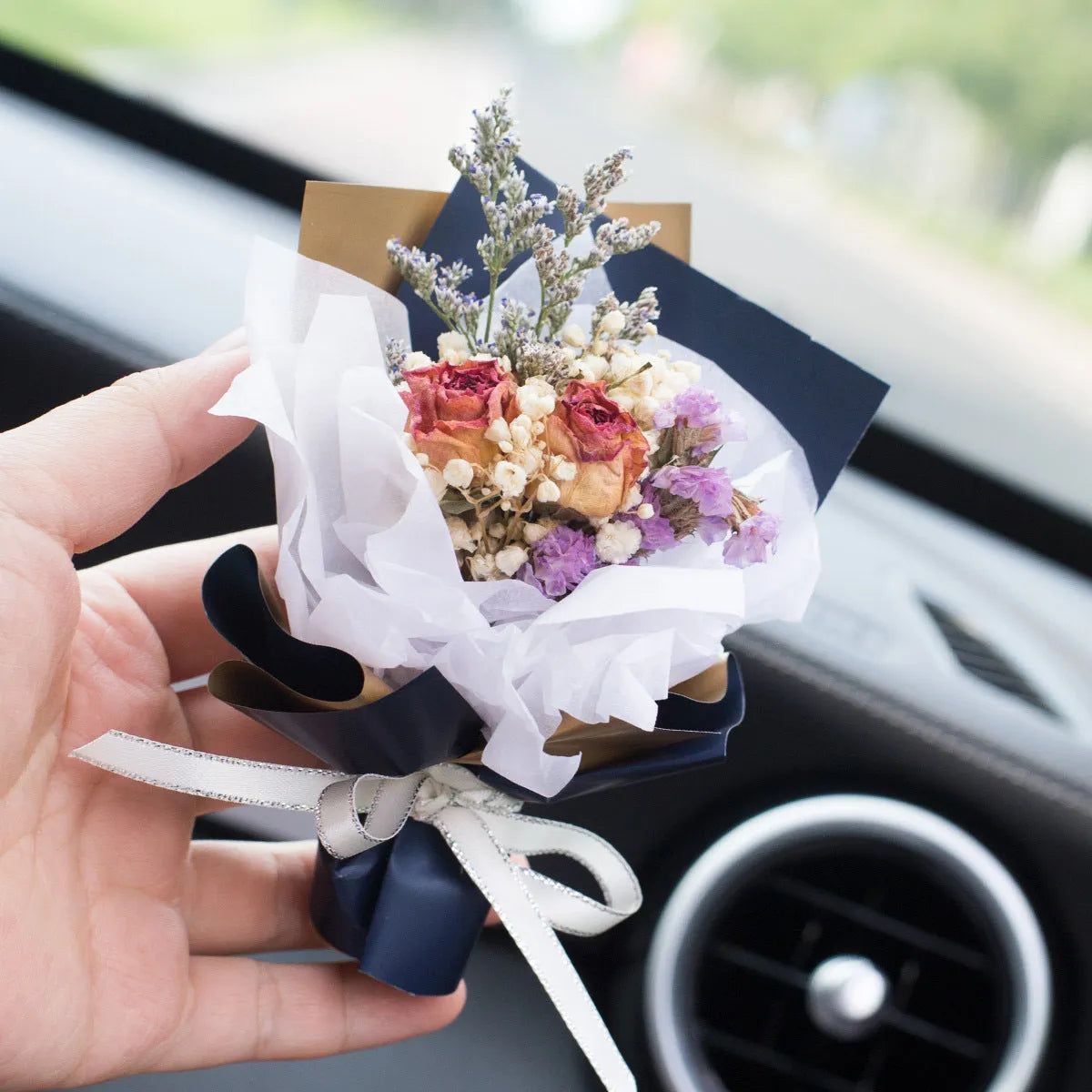 Handmade dried flower car air freshener ornament in multiple colours mounted on car vent