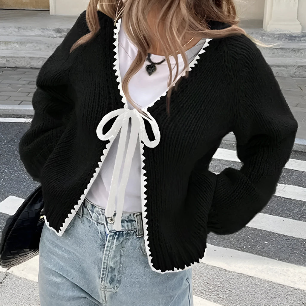 Women's gray loose-fit cardigan with crocheted flower detail on the front