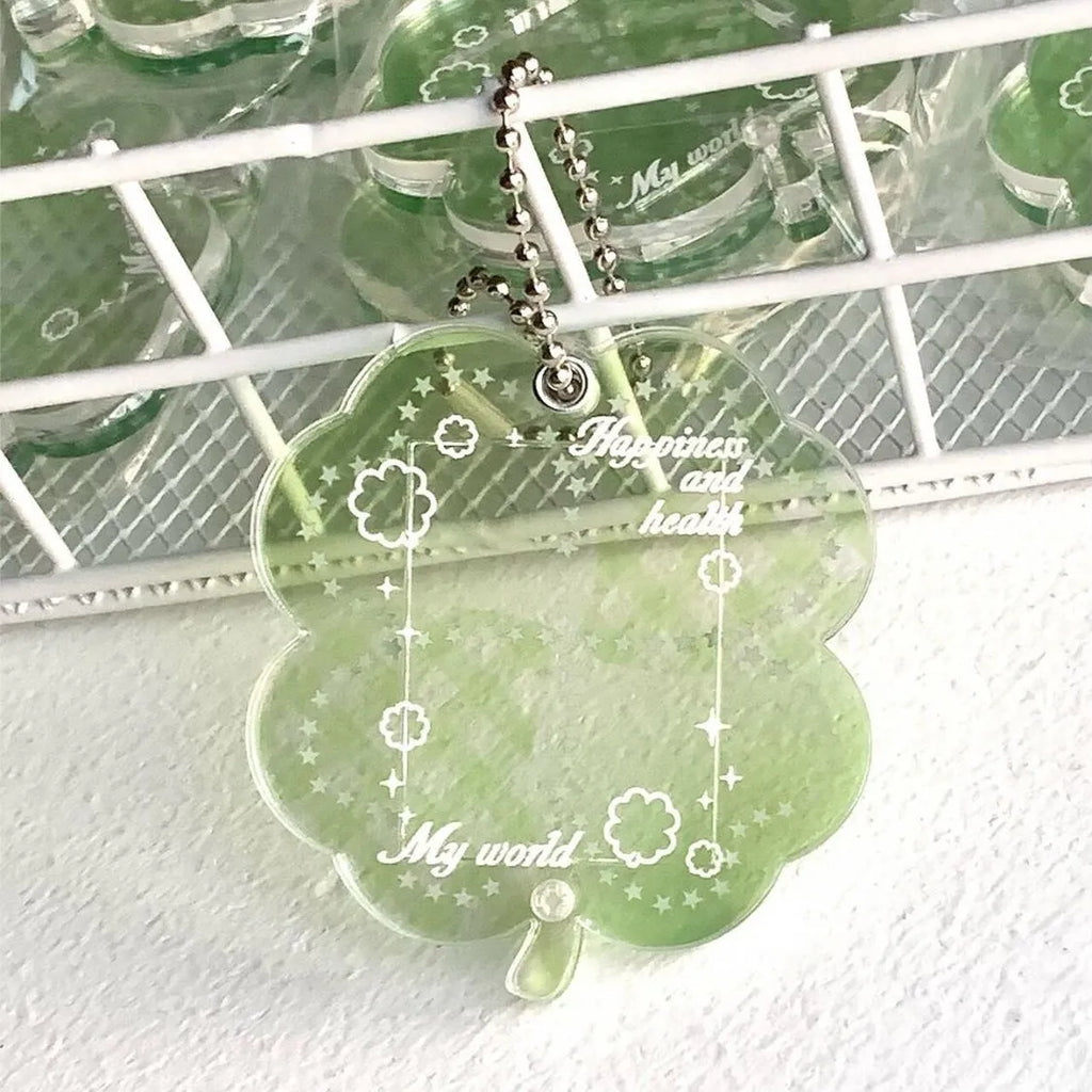 Acrylic four-leaf clover pendant keychain for phones in blue, green, or mint.