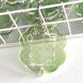 Acrylic four-leaf clover pendant keychain for phones in blue, green, or mint.