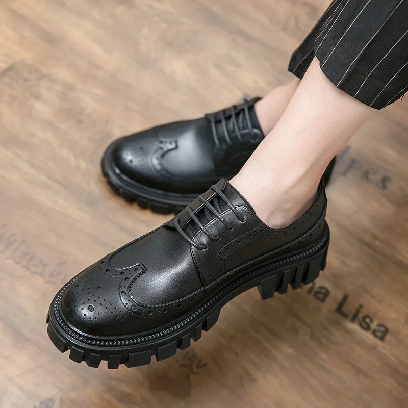 Men's black brogue leather shoes with round toe on a solid background