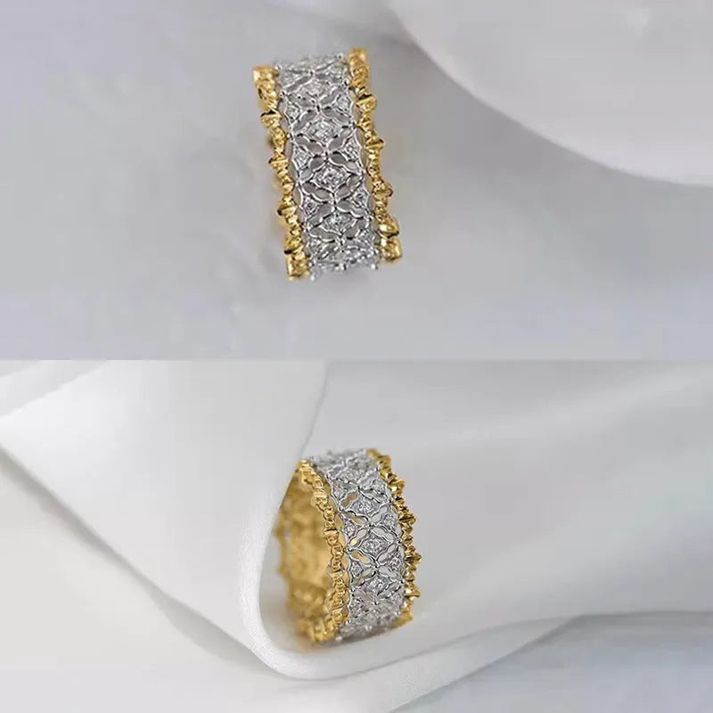 Geometric two-tone copper ring with a round zircon stone on a finger.
