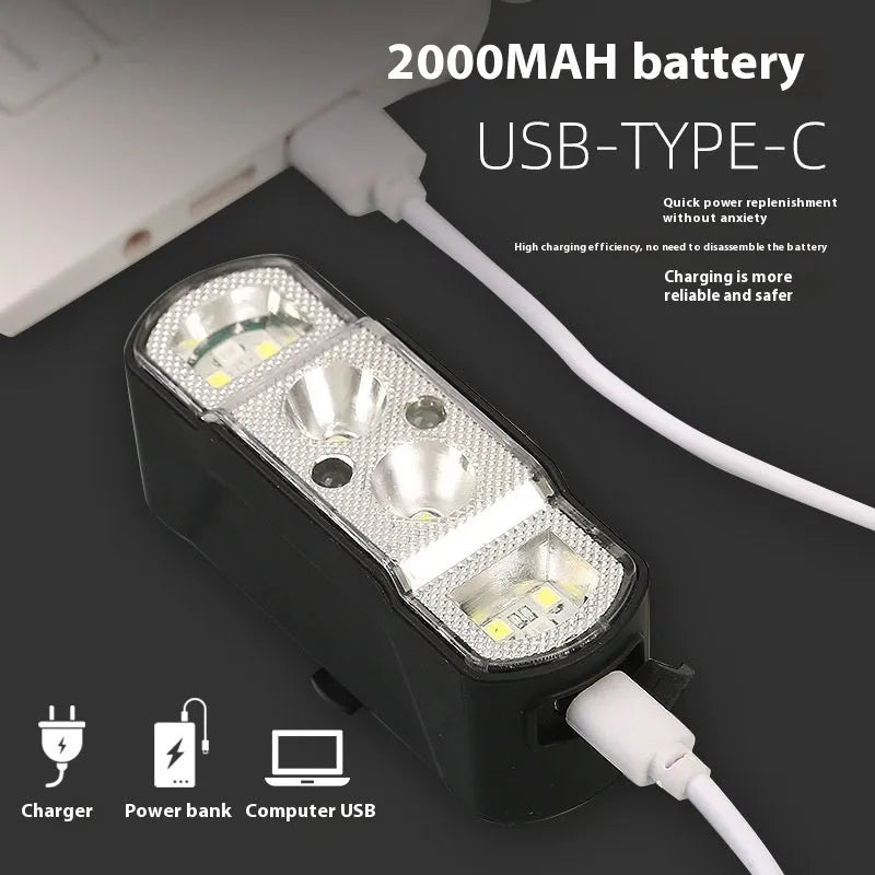 Black bicycle headlight with 350 lumen LED and removable 18650 battery mounted on handlebars