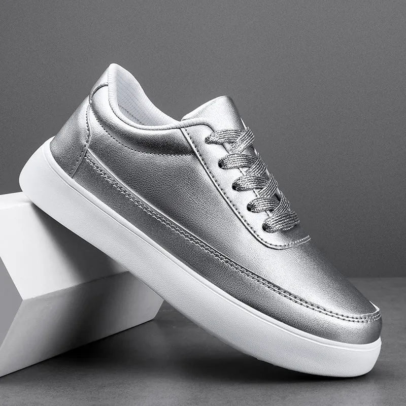 Women's white leather flat lace-up casual shoes on a plain background