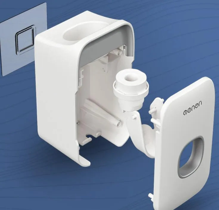 Wall-mounted automatic toothpaste dispenser in blue, grey, or pink colours with a visible dispensing lever.