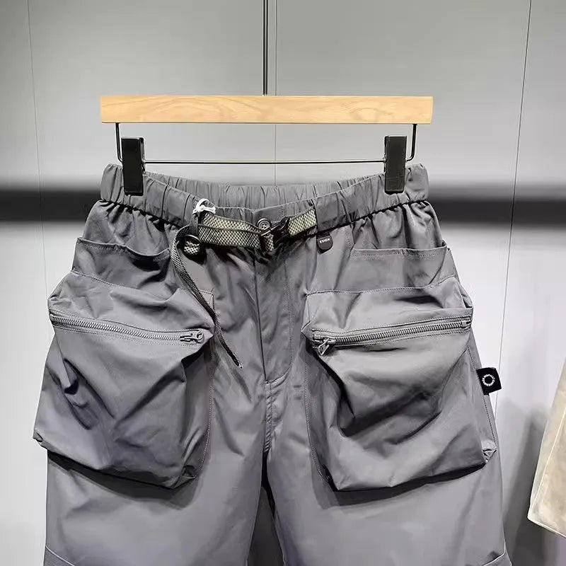 Men's black workwear shorts with pockets, loose fit, and straight leg hem