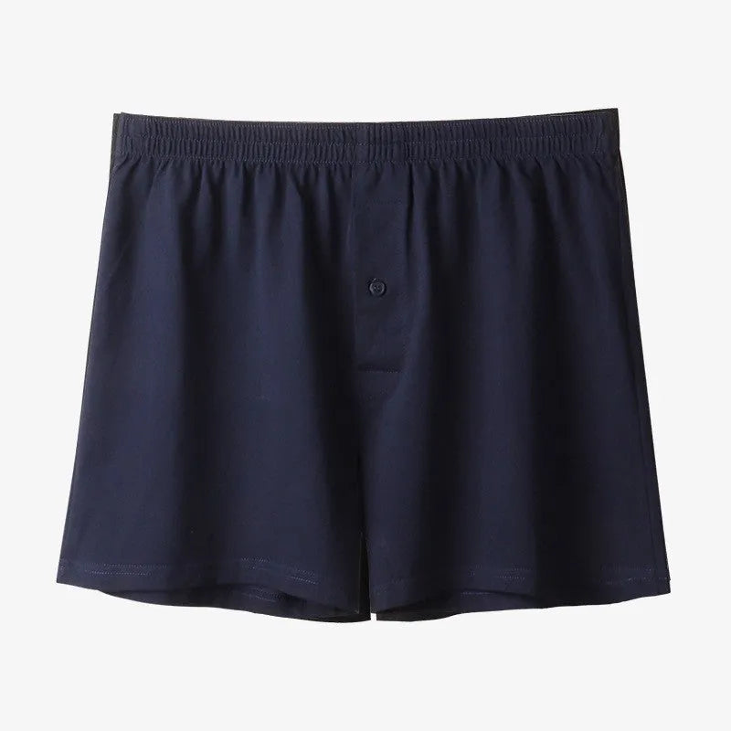 Men's solid colour cotton boxer shorts with a high waist and loose fit.