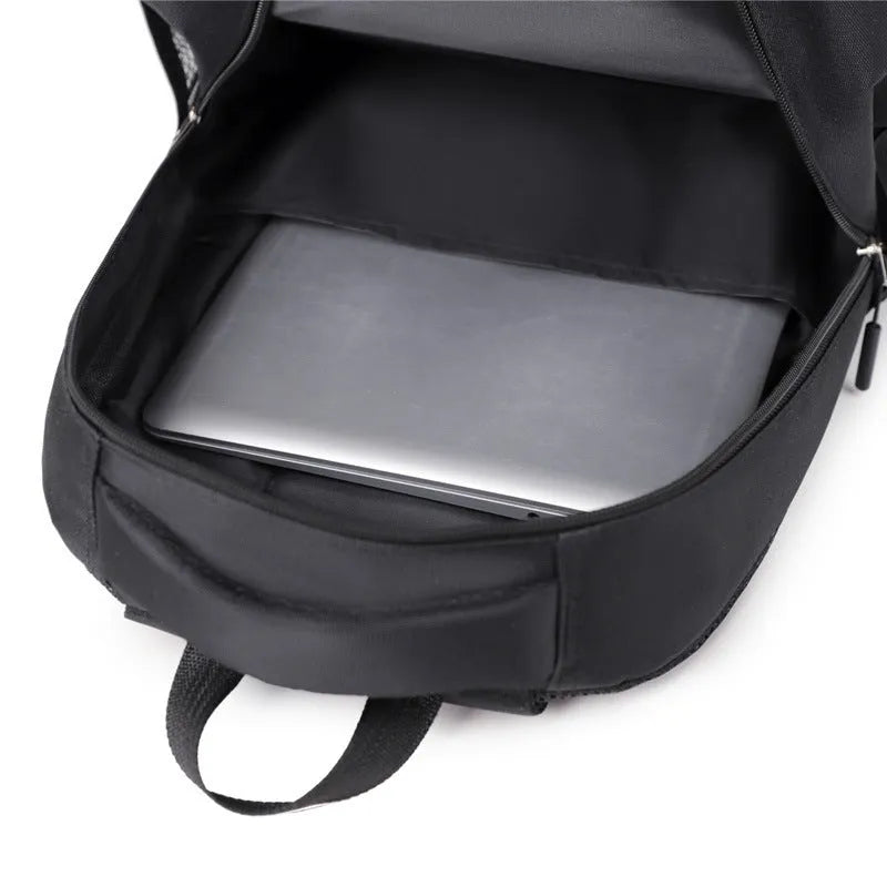 Casual men's Oxford cloth backpack in a choice of black, blue, gray, or green colours