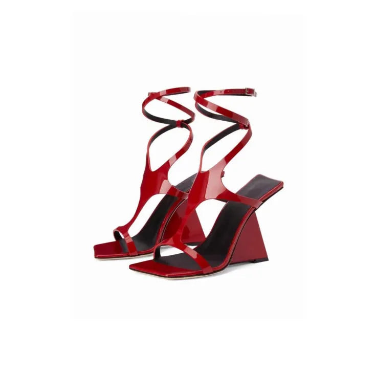 Women's black high heel sandals with a square toe and 9.5cm heel, showing button closure.