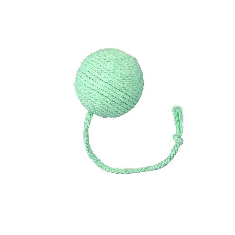Cat toy ball with rope attached in green, pink, purple, or yellow colours with internal bell