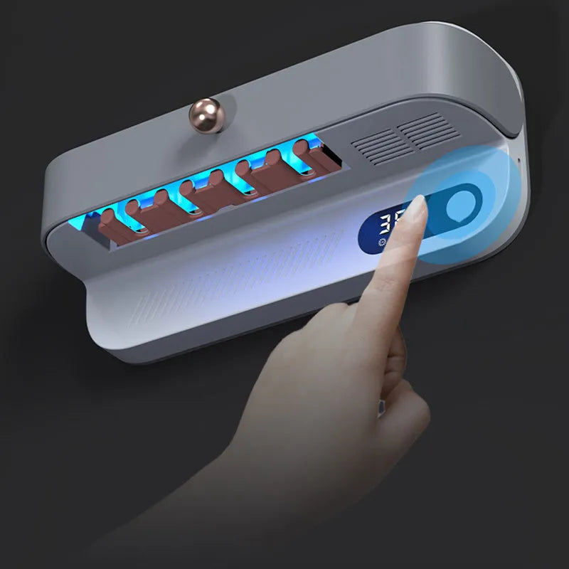 White wall-mounted smart toothbrush steriliser with USB charging port and control button for UV disinfection