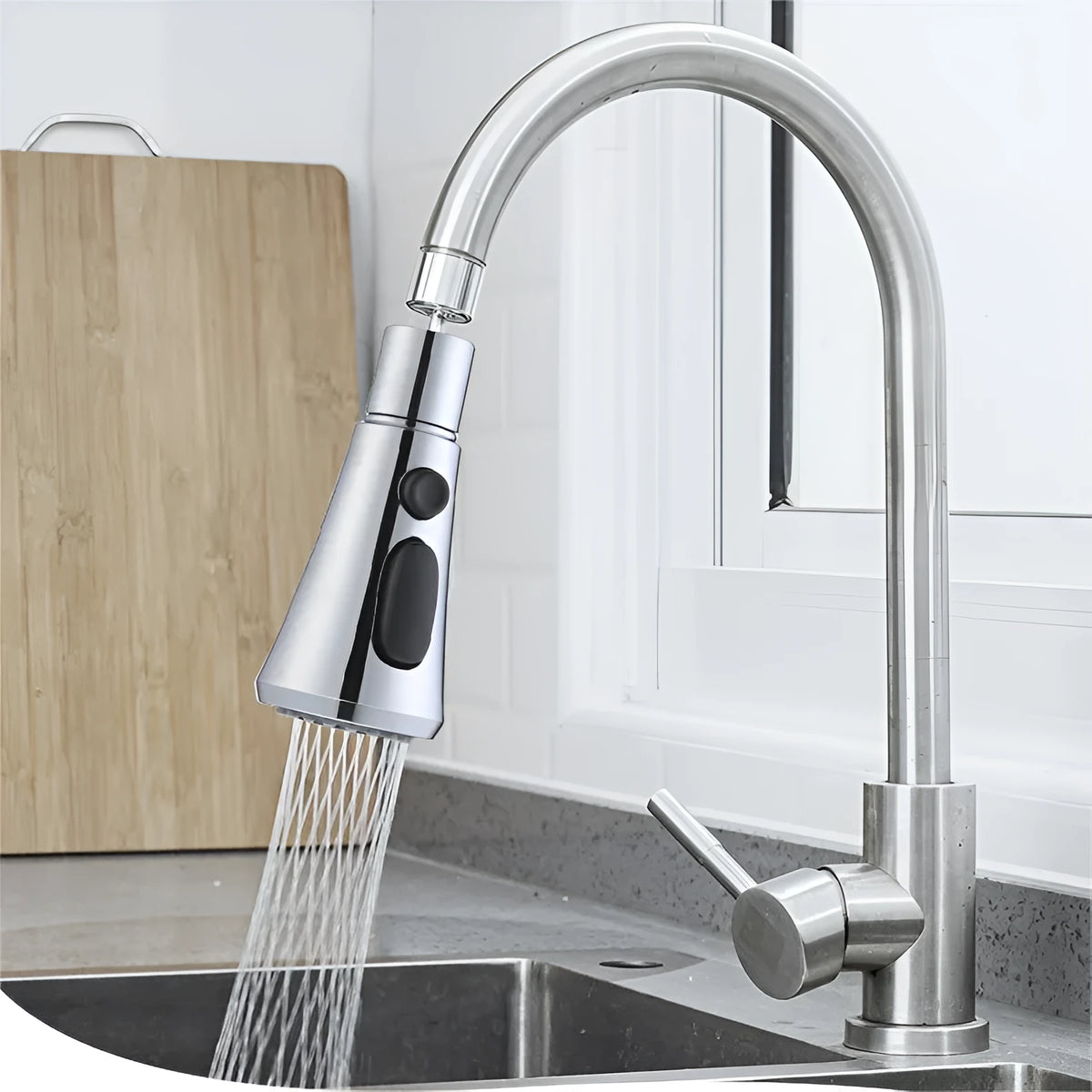 Silver universal kitchen faucet sprayer with rotating head shown on a sink tap.