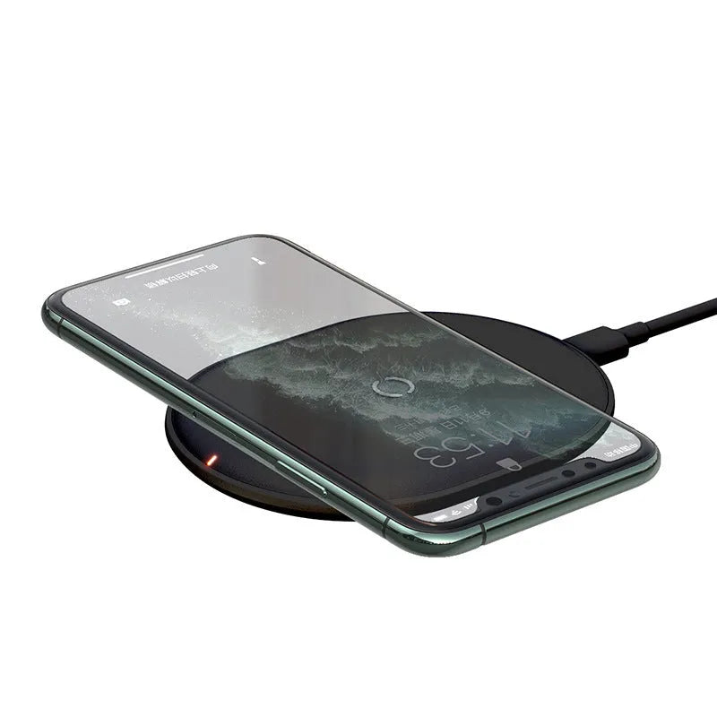 Baseus Rough 15W fast wireless charging pad for mobile phones in black colour on a desk.