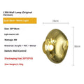 Modern creative lava wall lamp with acrylic shade, 30x18cm, gold finish, on a wall emitting warm light