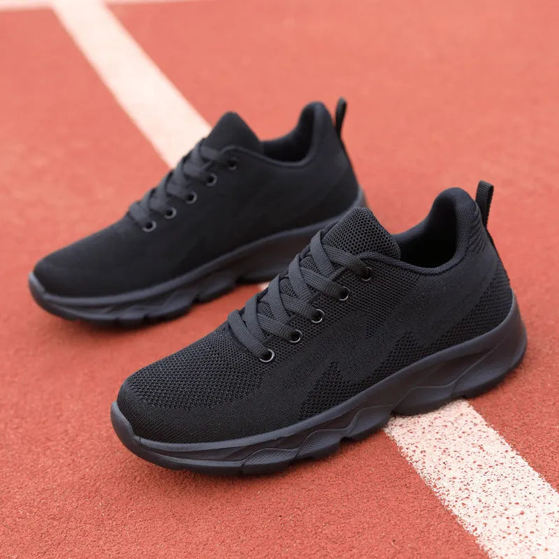 Women's lightweight mesh breathable running shoes with wedge heel in black upper side view