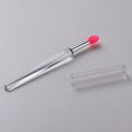 Set of four reusable silicone lip brushes with protective caps in assorted colours