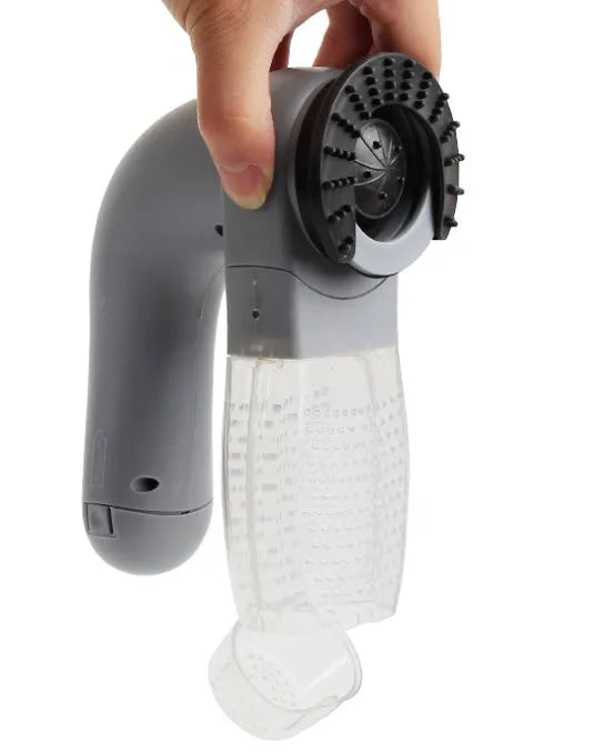 Grey portable electric pet hair vacuum cleaner with soft rubber grooming head.