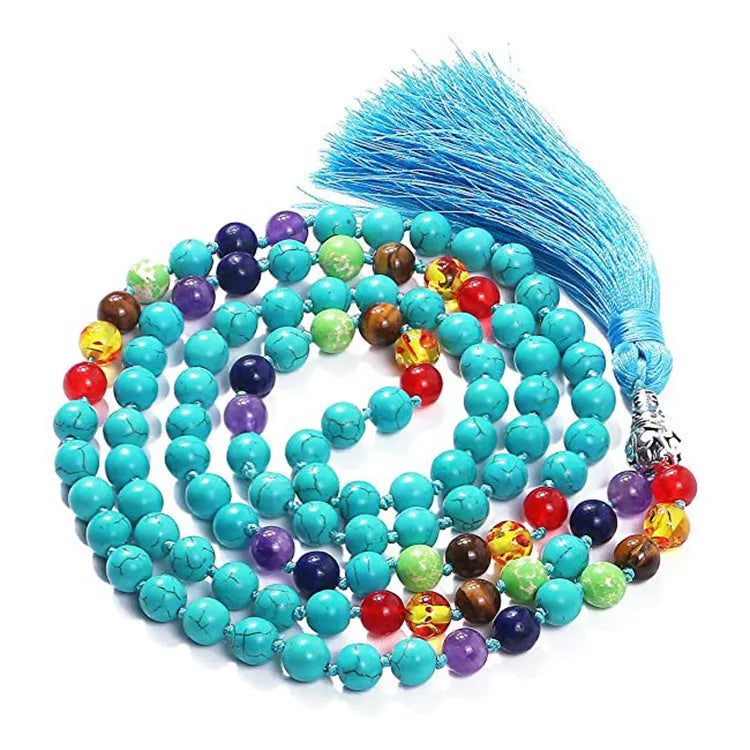 Long multicoloured agate tassel necklace with geometric beads and a flowing pendant.