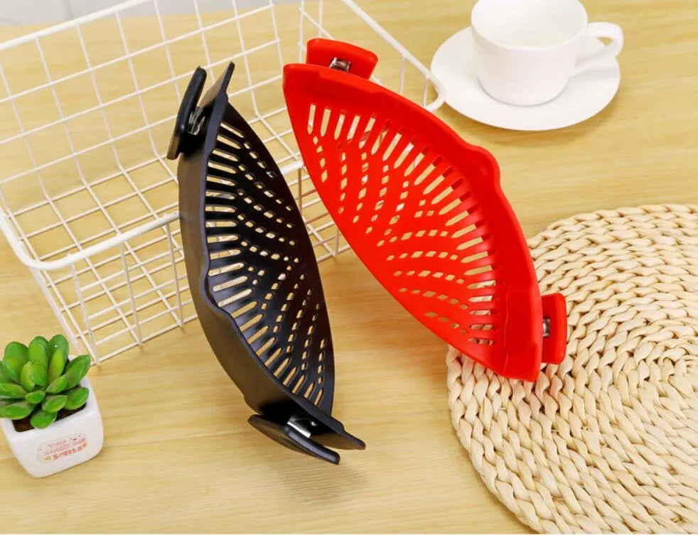 Silicone clip-on kitchen strainer with stainless steel mesh attached to cooking pot