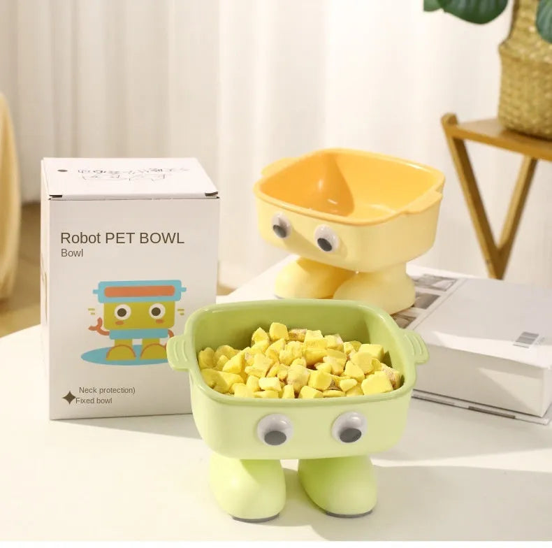 Green robot-shaped elevated cat bowl with 15-degree tilt and detachable inner dish