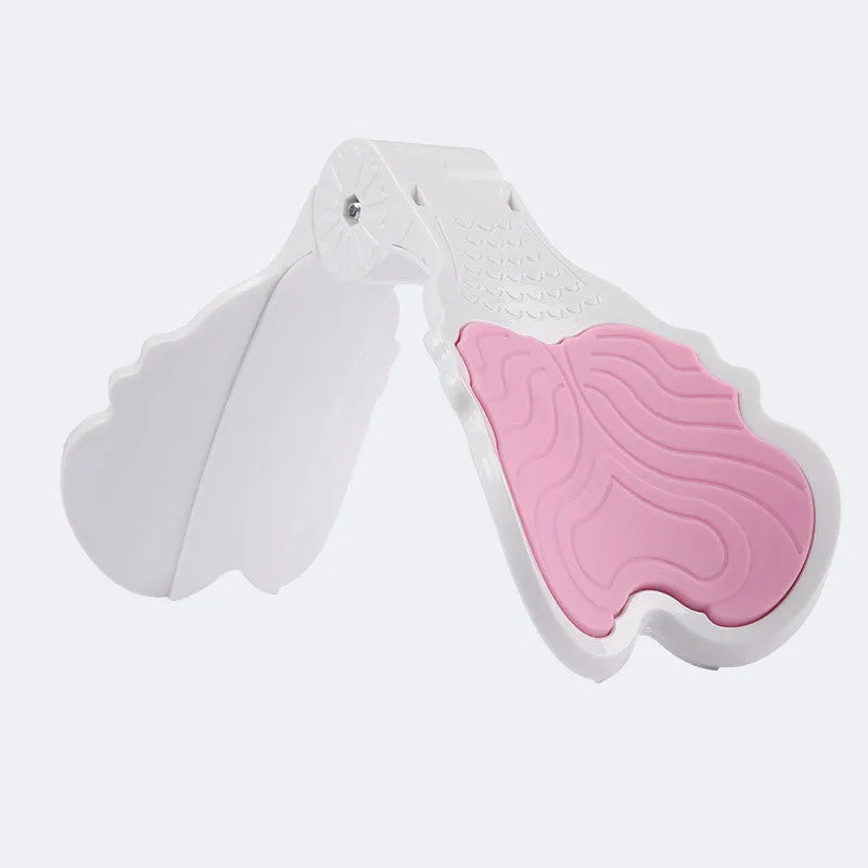 Pink hip trainer with silicone surface measuring 27cm by 9.5cm for pelvic floor and inner thigh exercises