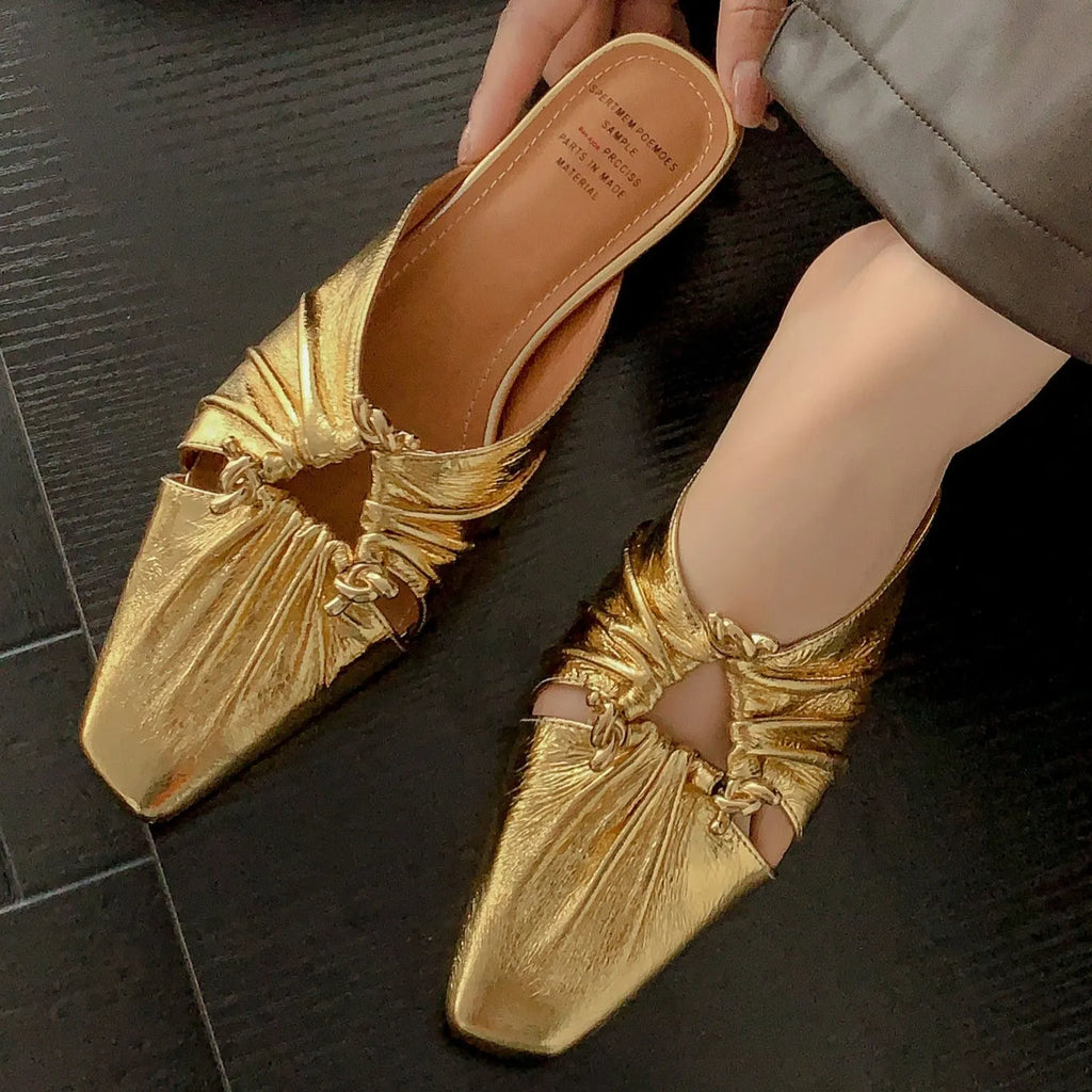 Women's genuine leather slipper with a square toe in a gold colour, showing the low heel and slip-on design.
