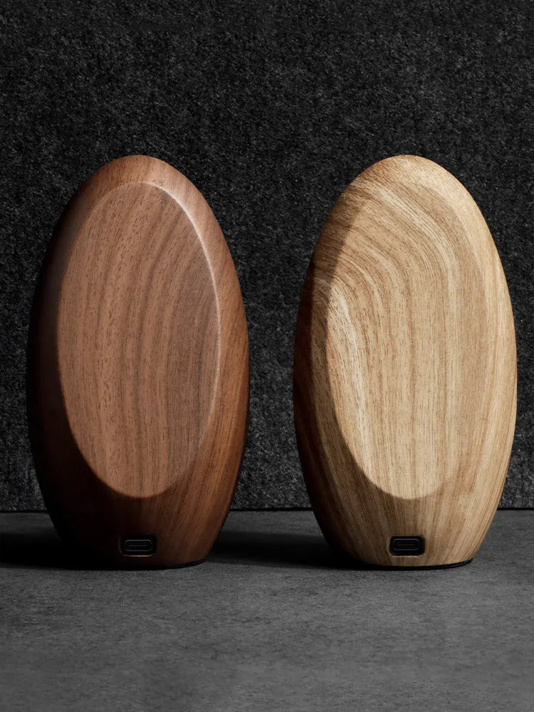 Creative Magsafe magnetic phone holder wireless charger in walnut resin colour on desk, 15.5cm length