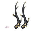 A pair of black resin dragon horn decorations for motorcycle helmet customisation.