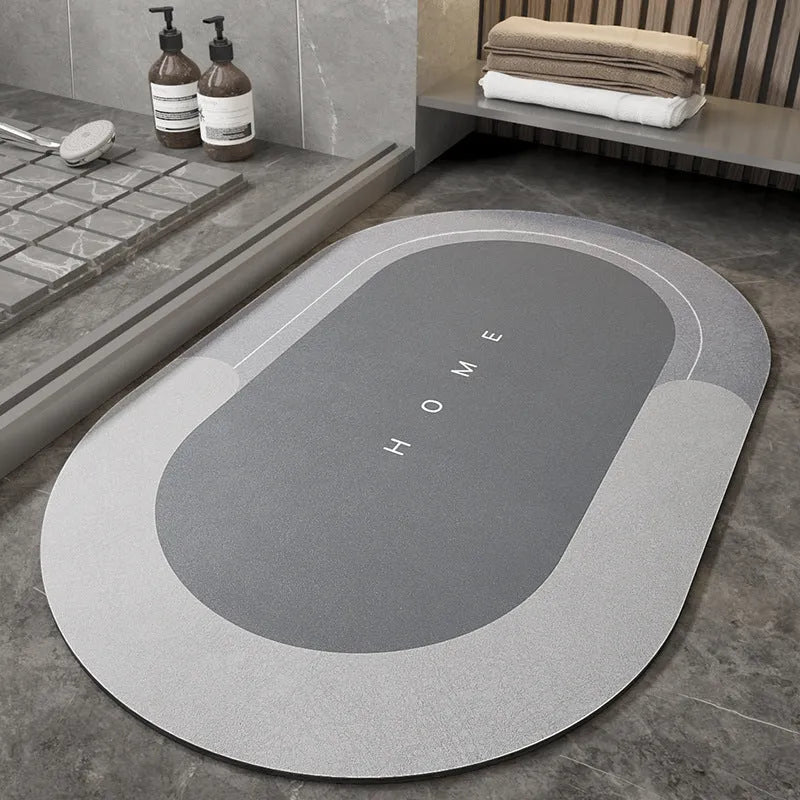 Blue oval blended bathroom floor mat on tiled floor next to a bath.