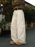 Men's loose fit straight leg trousers with pleated waist in black, brown and apricot colours