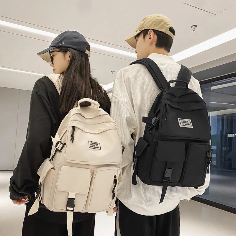 Soft nylon student backpack in black with laptop compartment and three-dimensional pocket