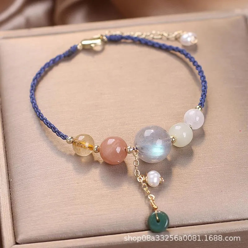 Hand-woven women's bracelet with peace buckle, crystal beads, and sequins in red, green, or blue.