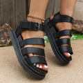 Men's black strap buckle sandals with thick rubber sole and fish mouth toe.